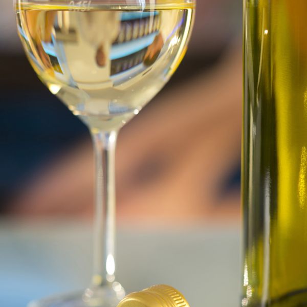 White Wine bottle and glass and screw top