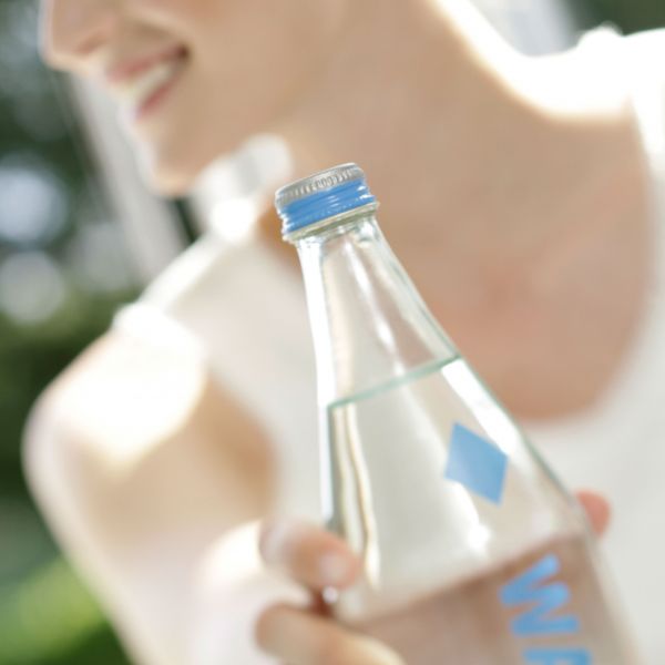 Woman holding water bottle