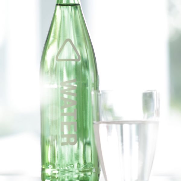 Water bottle and glas on table